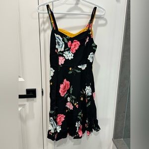 2 for the price of 1 black and yellow floral sun dresses. Old navy.